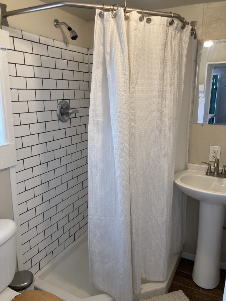 Cabin has small bathroom with shower